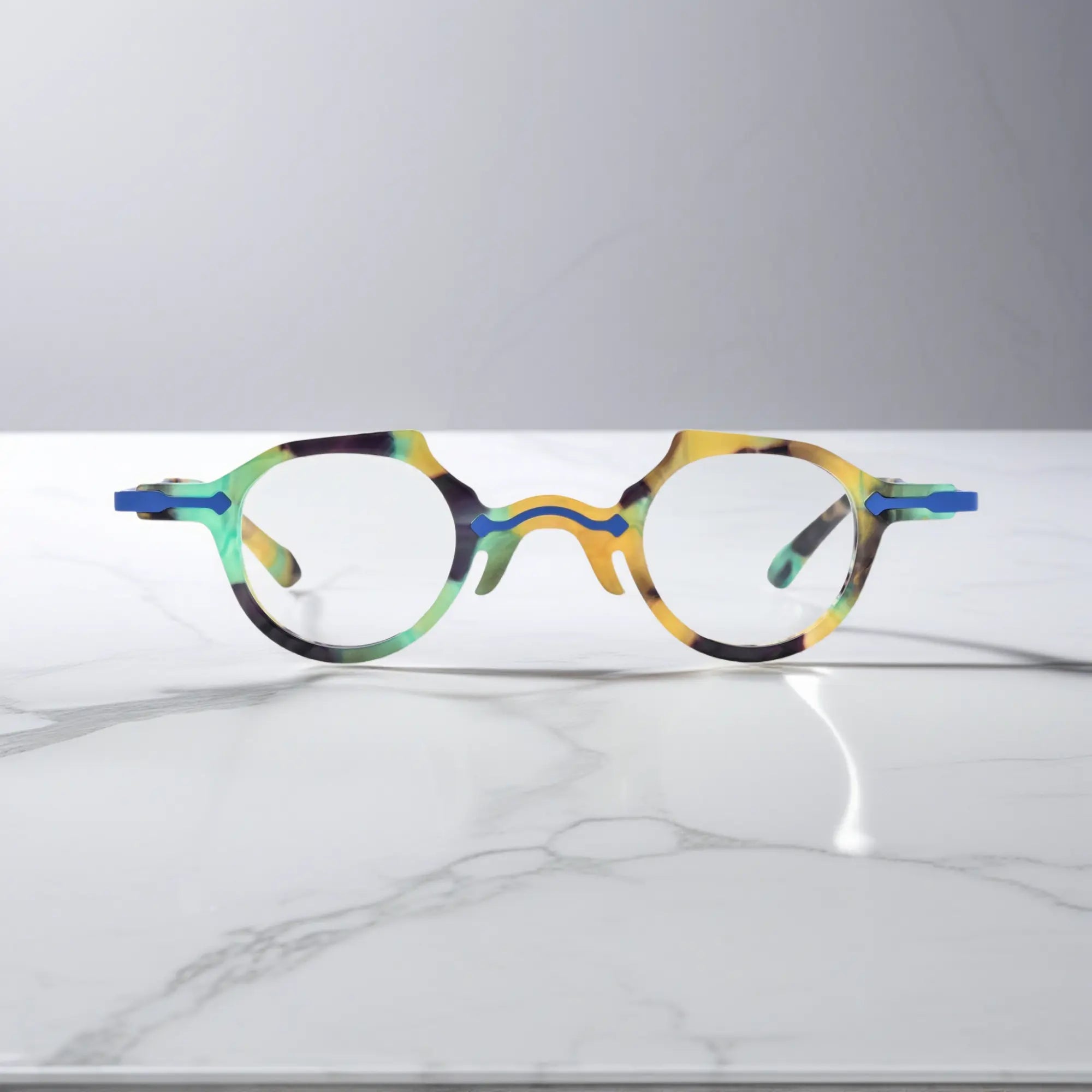 Front view of VoyueLens™ VL19341 glasses in bold cobalt blue acetate, emphasizing a crisp round frame with glossy surface and stylish presence.